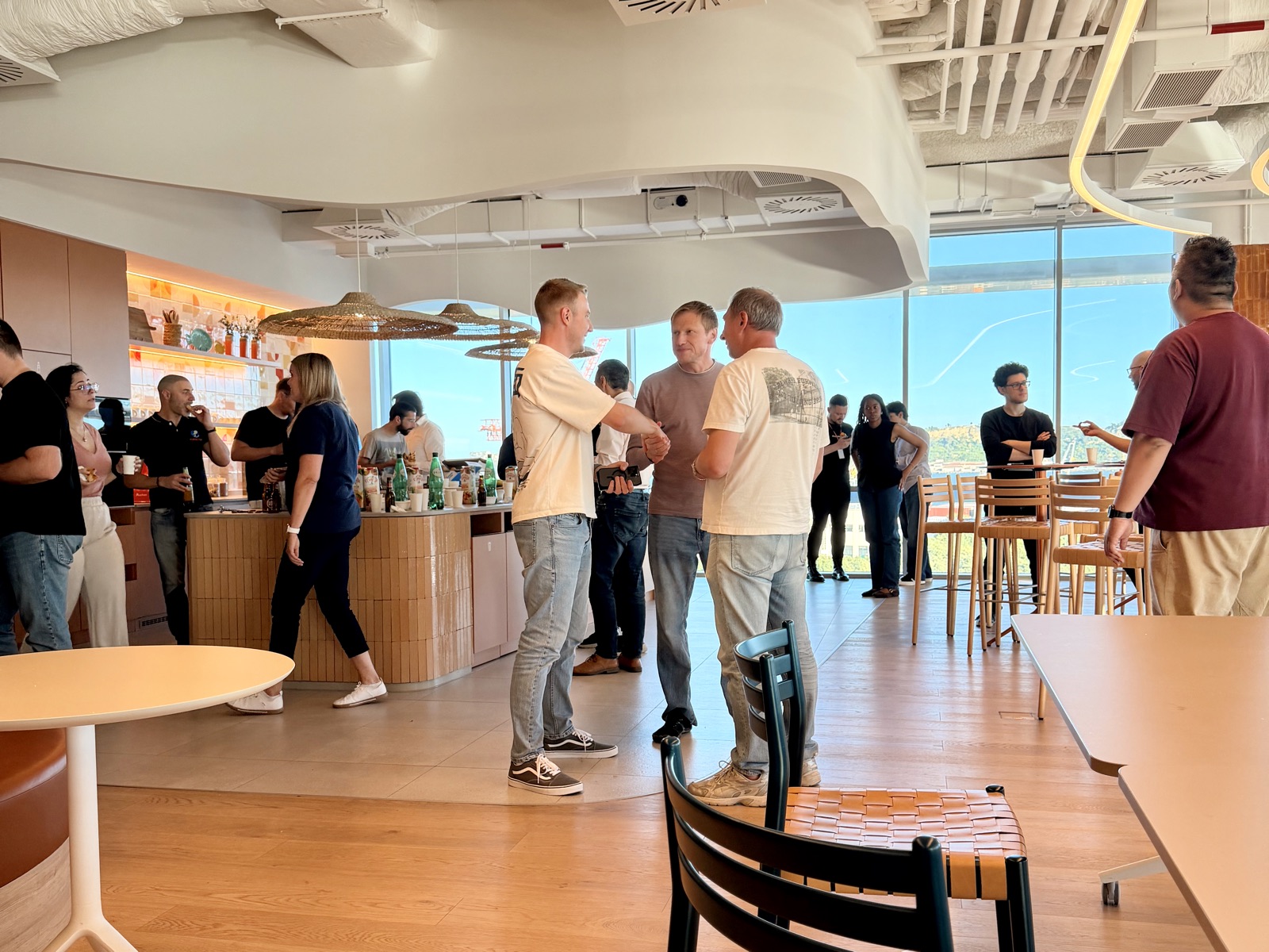 Conversations with attendees after the talk at the Cloudflare Lisbon office